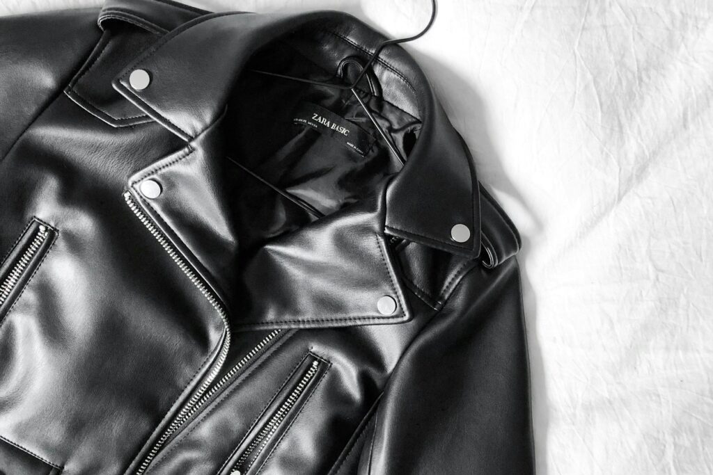 Black leather jacket laid flat for close inspection